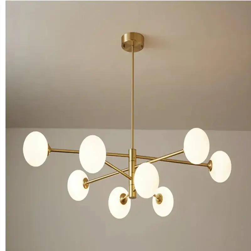 Gold chandelier with glass globe for indoor lighting Commander Maintenant