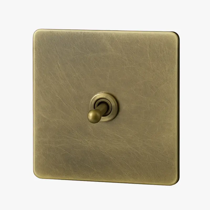 Single gang switch in brushed aged grey steel with rounded edges Commander Maintenant